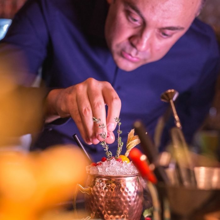 drink photography of a bartender preparing a cocktail